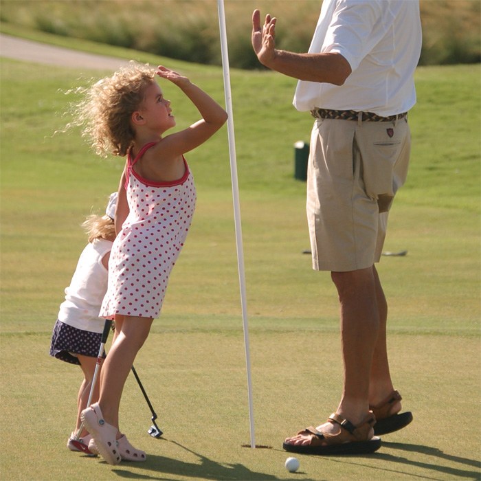 Parent support young kid in Mesa golf lessons AZ